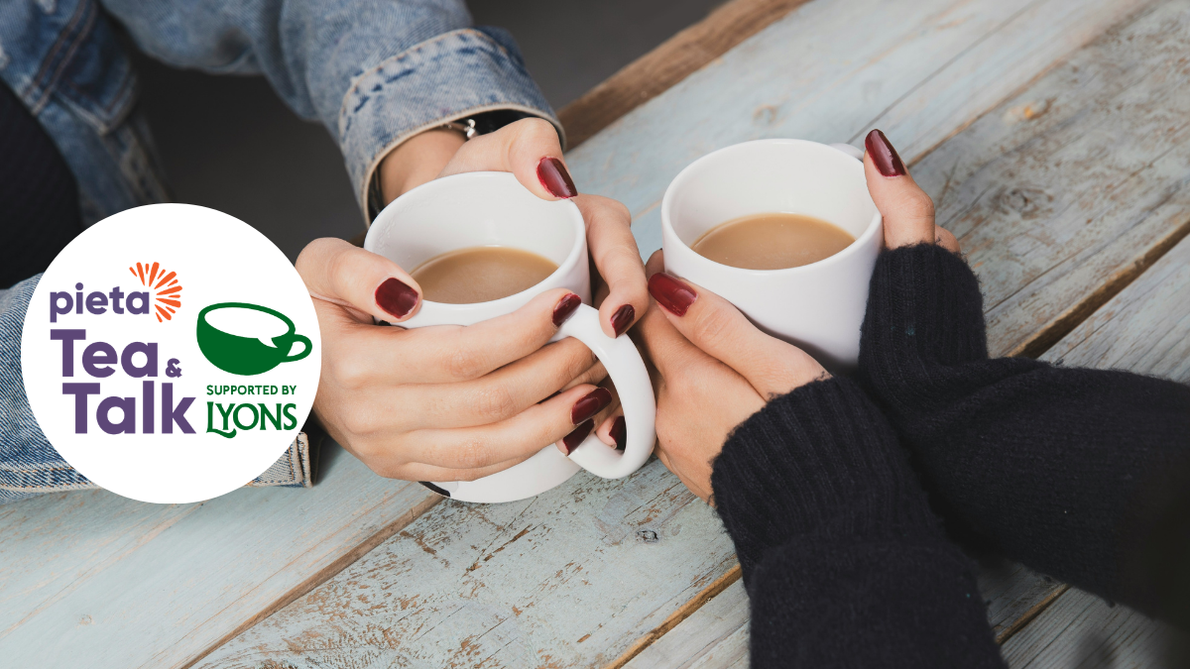 Tea and Talk - 2 mugs being held next to each other and Tea and Talk logo